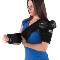 Woman applying ICE20 Double Shoulder Ice Compression Therapy